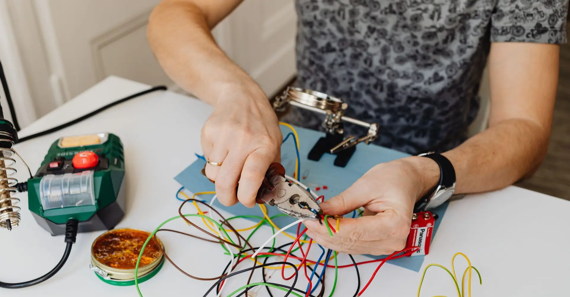 Electrician working with wire and pliers for an owner-run electrical company in Terrell TX
